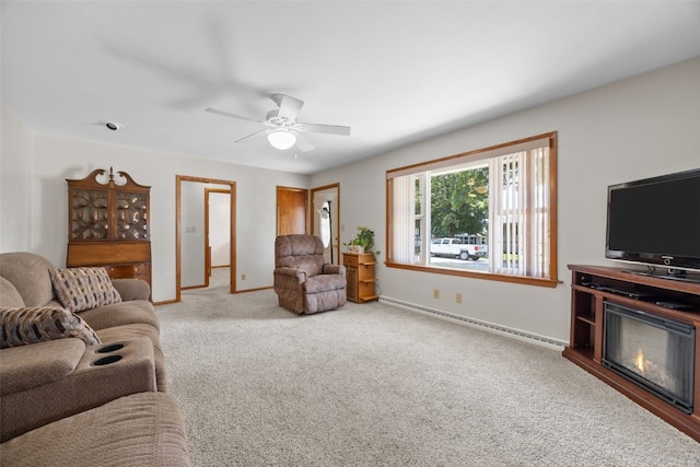 330 E S St, Lisbon, IA 52253 - carpeted living area with ceiling fan and baseboard heating