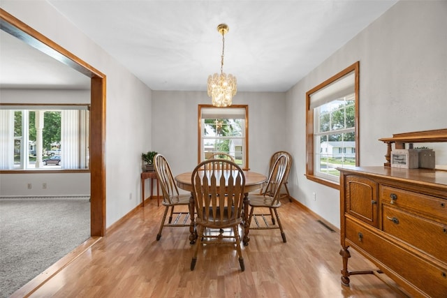 330 E S St, Lisbon, IA 52253 - dining space featuring plenty of natural light, a chandelier, and light wood-type flooring