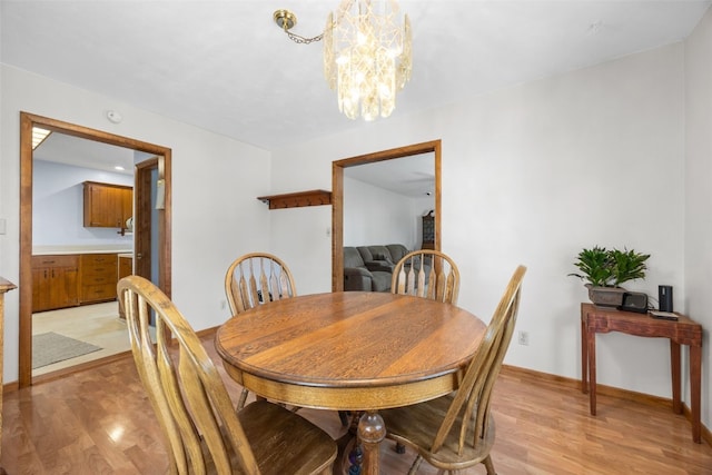 330 E S St, Lisbon, IA 52253 - dining space with a chandelier and light wood-type flooring