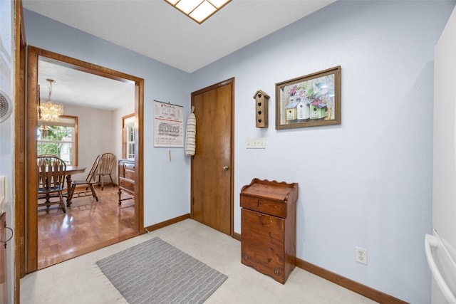330 E S St, Lisbon, IA 52253 - foyer with a chandelier and baseboards