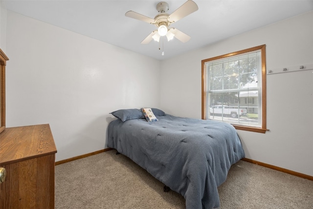 330 E S St, Lisbon, IA 52253 - bedroom with light colored carpet and ceiling fan