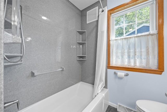 330 E S St, Lisbon, IA 52253 - bathroom featuring shower / bath combo with shower curtain and toilet