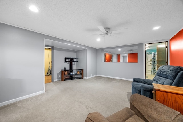 330 E S St, Lisbon, IA 52253 - living room featuring a ceiling fan, carpet flooring, recessed lighting, and a textured ceiling