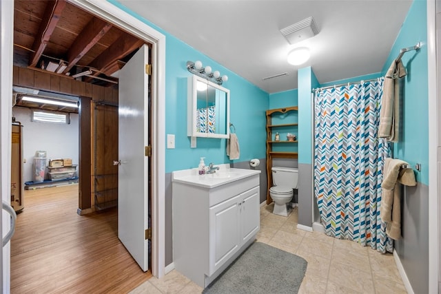330 E S St, Lisbon, IA 52253 - bathroom with vanity, curtained shower, and tile patterned flooring