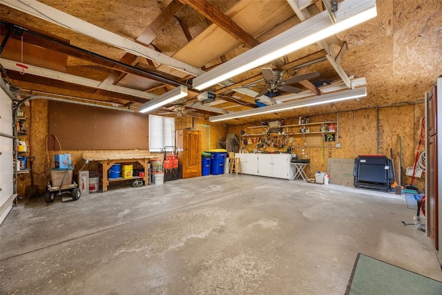 330 E S St, Lisbon, IA 52253 - garage with a workshop area, a garage door opener, and a ceiling fan
