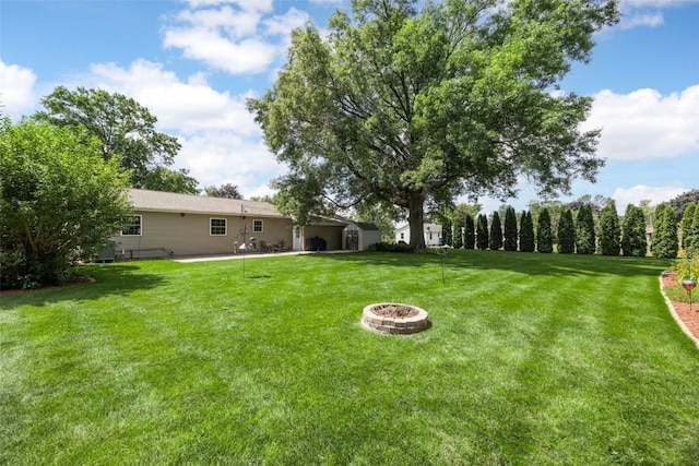 330 E S St, Lisbon, IA 52253 - view of green lawn with an outdoor fire pit and a patio