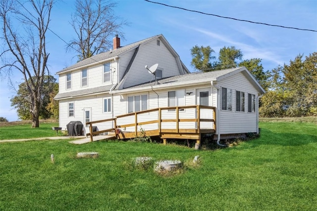 4100 Greens Grove Rd, Center Point, IA 52213 - rear view of house with a chimney, a lawn, and a wooden deck