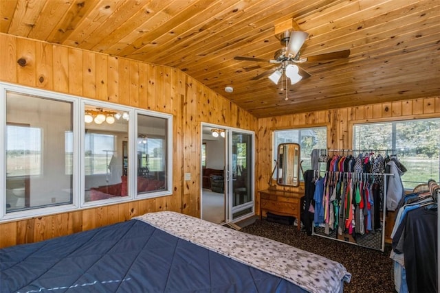 4100 Greens Grove Rd, Center Point, IA 52213 - carpeted bedroom with vaulted ceiling, wooden walls, and wooden ceiling