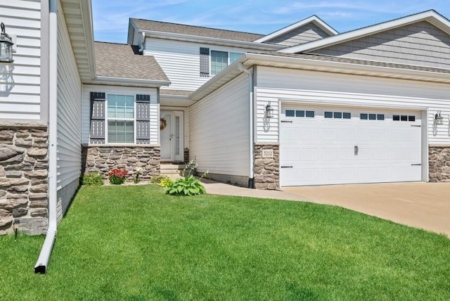 3212 Sherwood Pl, Marion, IA 52302 - view of front of property featuring stone siding, a garage, concrete driveway, a front lawn, and roof with shingles