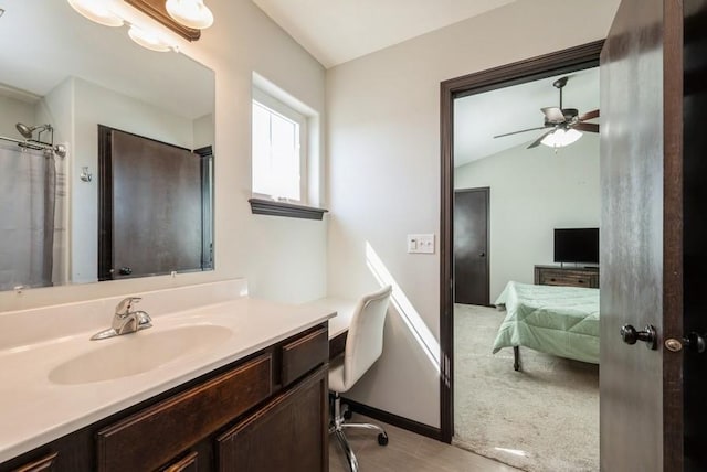 3212 Sherwood Pl, Marion, IA 52302 - ensuite bathroom featuring vanity, ceiling fan, lofted ceiling, and wood finished floors