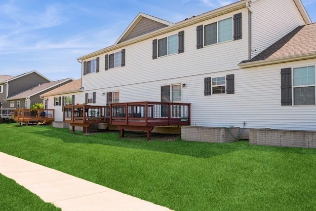 3212 Sherwood Pl, Marion, IA 52302 - rear view of property with a deck, a lawn, and roof with shingles
