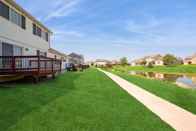3212 Sherwood Pl, Marion, IA 52302 - view of grassy yard with a deck with water view and a residential view
