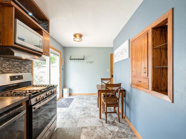 820 Hillview Dr, Marion, IA 52302 - kitchen with stainless steel appliances, open shelves, extractor fan, dark countertops, and decorative backsplash