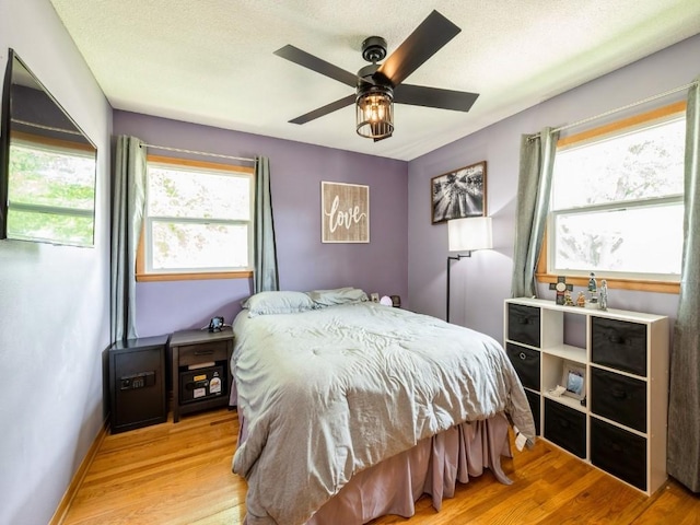 820 Hillview Dr, Marion, IA 52302 - bedroom featuring wood finished floors and ceiling fan