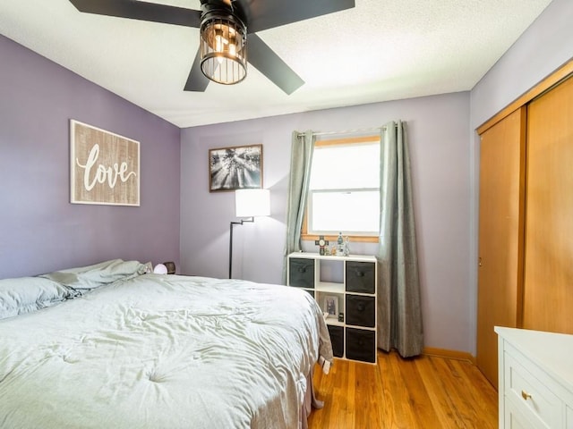820 Hillview Dr, Marion, IA 52302 - bedroom with a closet, light wood-type flooring, and ceiling fan