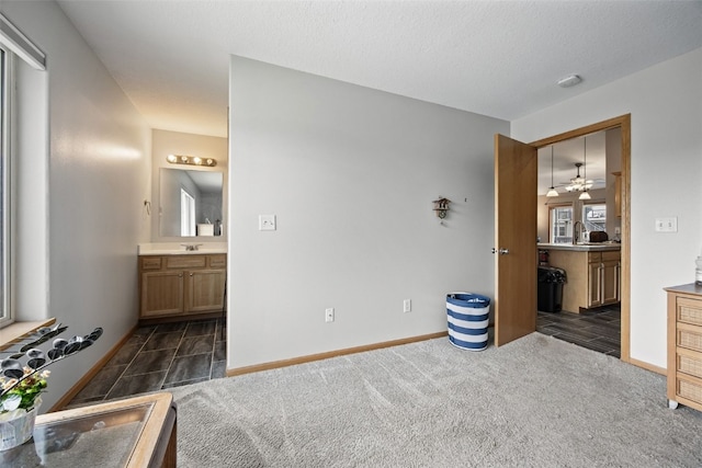 609 W Orange St, West Branch, IA 52358 - bedroom featuring ensuite bathroom and dark colored carpet