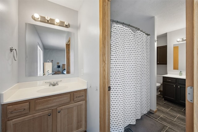 609 W Orange St, West Branch, IA 52358 - full bathroom featuring vanity and a shower with shower curtain