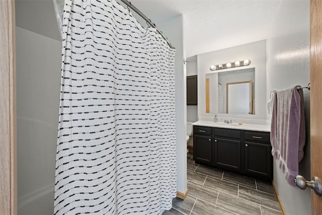 609 W Orange St, West Branch, IA 52358 - full bath featuring vanity and a shower with shower curtain