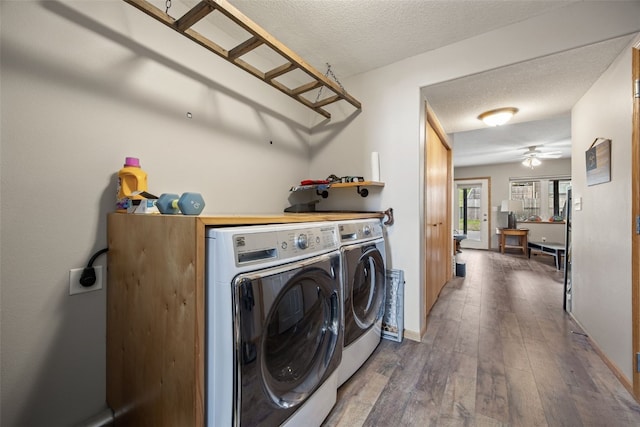609 W Orange St, West Branch, IA 52358 - laundry area featuring a textured ceiling, wood-type flooring, washing machine and dryer, a ceiling fan, and a desk