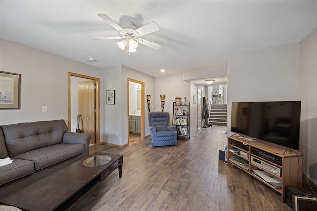 609 W Orange St, West Branch, IA 52358 - living area with ceiling fan, wood finished floors, and stairs