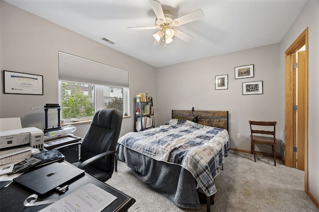 609 W Orange St, West Branch, IA 52358 - bedroom with carpet flooring, a desk, and ceiling fan