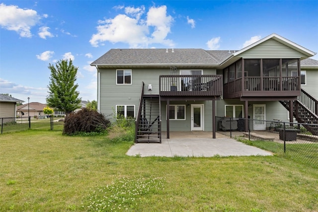 609 W Orange St, West Branch, IA 52358 - back of house with stairs, a sunroom, a patio area, a wooden deck, and a fenced backyard