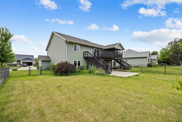 609 W Orange St, West Branch, IA 52358 - back of property featuring stairs, a fenced backyard, a deck, and a patio area