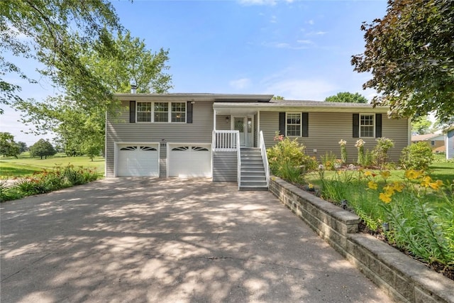 101 Golf Cir, Winfield, IA 52659 - view of front of home featuring asphalt driveway and an attached garage