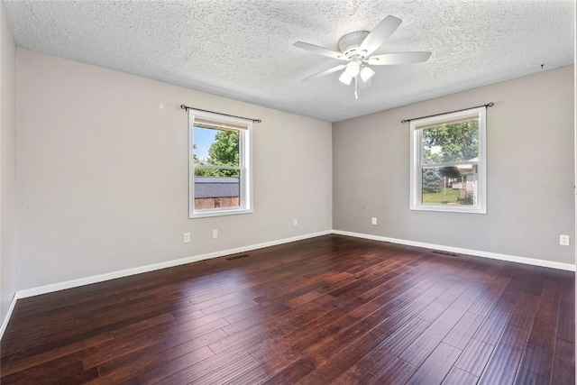 101 Golf Cir, Winfield, IA 52659 - unfurnished room featuring healthy amount of natural light, a ceiling fan, hardwood / wood-style flooring, and a textured ceiling