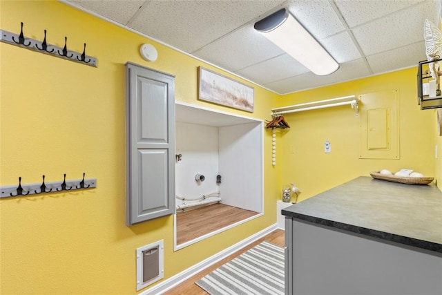 101 Golf Cir, Winfield, IA 52659 - interior space with a paneled ceiling, wood finished floors, and electric panel