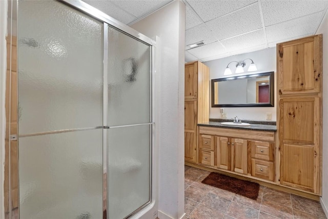 101 Golf Cir, Winfield, IA 52659 - bathroom with a paneled ceiling, a stall shower, and vanity
