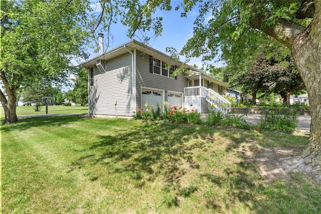 101 Golf Cir, Winfield, IA 52659 - view of home's exterior with a garage and a lawn