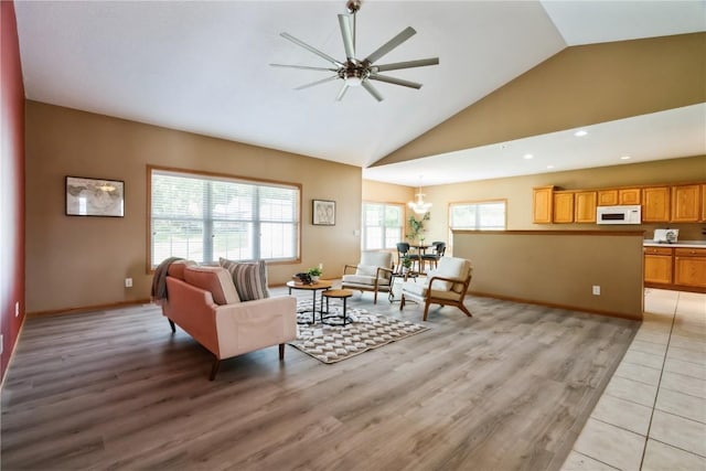 4118 Paradise Ct NW, Cedar Rapids, IA 52405 - living area with light wood-style flooring, ceiling fan, high vaulted ceiling, recessed lighting, and a chandelier