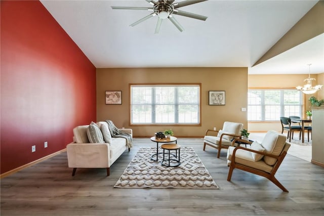 4118 Paradise Ct NW, Cedar Rapids, IA 52405 - living area featuring vaulted ceiling, a chandelier, ceiling fan, and wood finished floors