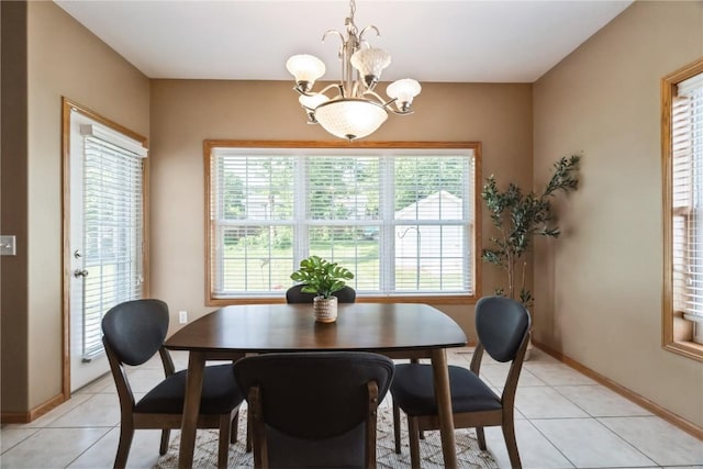 4118 Paradise Ct NW, Cedar Rapids, IA 52405 - dining room with healthy amount of natural light, a chandelier, and light tile patterned floors
