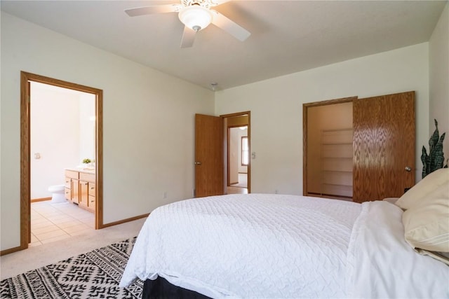 4118 Paradise Ct NW, Cedar Rapids, IA 52405 - bedroom featuring light carpet, connected bathroom, and a ceiling fan