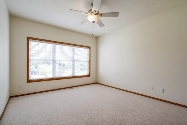 4118 Paradise Ct NW, Cedar Rapids, IA 52405 - empty room with light carpet and ceiling fan