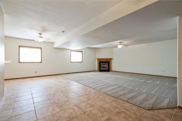 4118 Paradise Ct NW, Cedar Rapids, IA 52405 - unfurnished living room with ceiling fan, light tile patterned floors, light carpet, and a fireplace