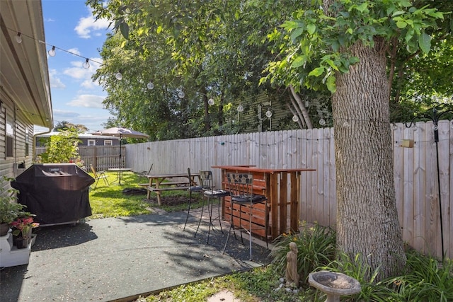 665 Hillview Dr, Marion, IA 52302 - fenced backyard featuring grilling area and a patio area