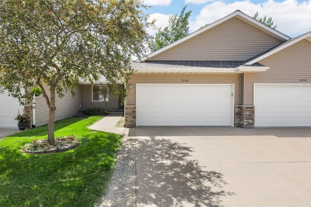 2054 Shortgrass Pl, Marion, IA 52302 - view of front of house featuring a garage, concrete driveway, a front yard, and a shingled roof