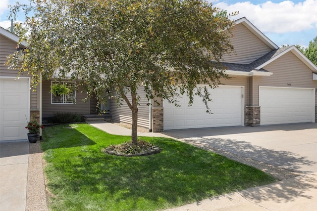 2054 Shortgrass Pl, Marion, IA 52302 - view of front of house featuring a garage, concrete driveway, a front lawn, and a shingled roof