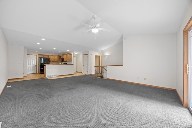 2054 Shortgrass Pl, Marion, IA 52302 - unfurnished living room featuring vaulted ceiling, a ceiling fan, light carpet, and recessed lighting