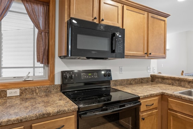 2054 Shortgrass Pl, Marion, IA 52302 - kitchen featuring black appliances and brown cabinetry