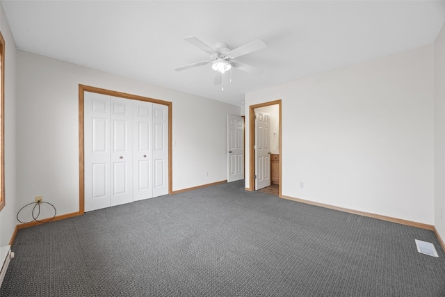 2054 Shortgrass Pl, Marion, IA 52302 - unfurnished bedroom with carpet, a closet, and a ceiling fan