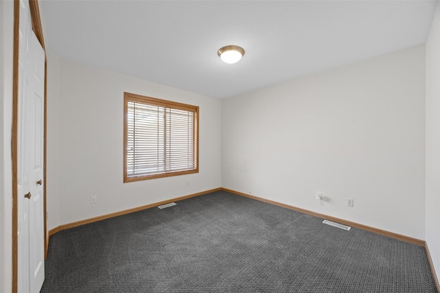 2054 Shortgrass Pl, Marion, IA 52302 - unfurnished room featuring baseboards and dark colored carpet