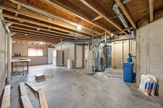 2054 Shortgrass Pl, Marion, IA 52302 - below grade area with freestanding refrigerator, water heater, and heating unit