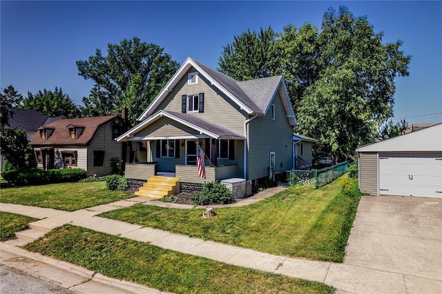 701 Hall Ave, Lowden, IA 52255 - view of front of house with a porch, an outbuilding, driveway, and a garage