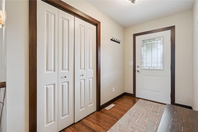 8313 Monterey Dr NE, Cedar Rapids, IA 52402 - entrance foyer featuring dark wood-style flooring and baseboards