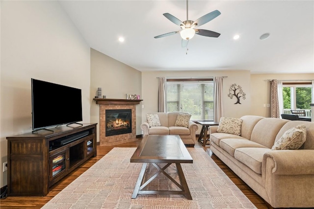 8313 Monterey Dr NE, Cedar Rapids, IA 52402 - living room with vaulted ceiling, wood finished floors, ceiling fan, a fireplace, and recessed lighting