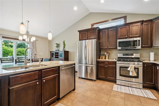 8313 Monterey Dr NE, Cedar Rapids, IA 52402 - kitchen with appliances with stainless steel finishes, lofted ceiling, dark brown cabinetry, a chandelier, and pendant lighting